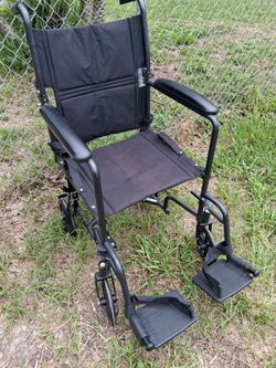VERY NICE  FOLDABLE WHEEL CHAIR