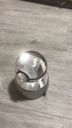 pikachu in Poke ball that glows with batteries