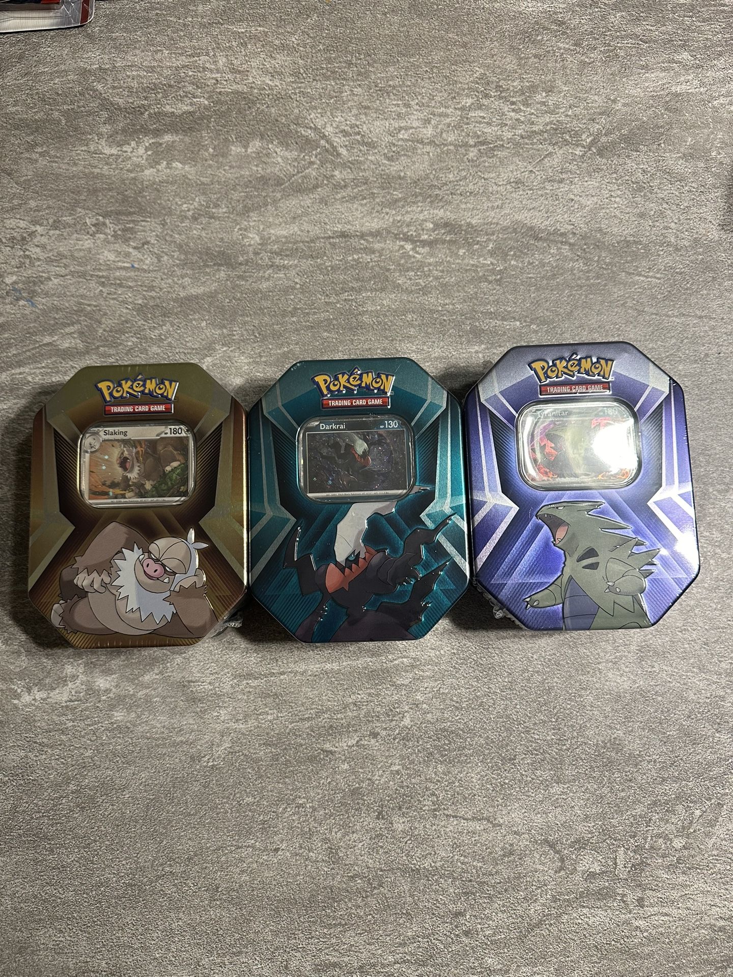 Pokémon : Tins (3) Slaking Tin, Darkrai Tin, Tyranitar Tin. ($20 Each)