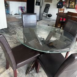 Round, glass-top dining Table + Chairs