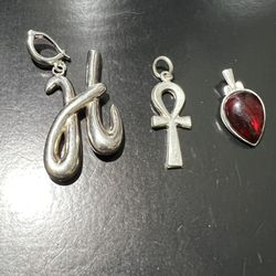 FOUR  PURE STERLING SILVER CHARMS THE THREE MEDIUM SIZE EACH ONE $16 AND BIG ONE IS $25  
