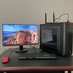 gaming pc setup with monitor mouse keyboard and cords