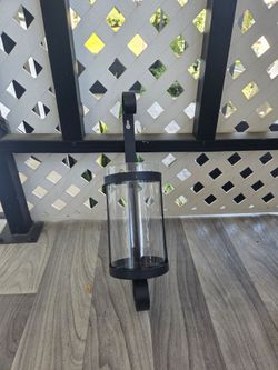 black metal wall candle holder