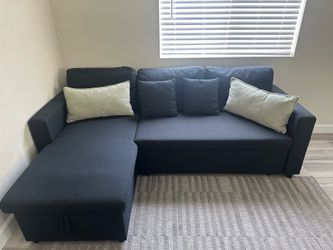 Black sofa with chaise and pull-out sleeper