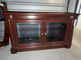Cherry Wood TV Stand with Glass Doors for two days only in the area listed
