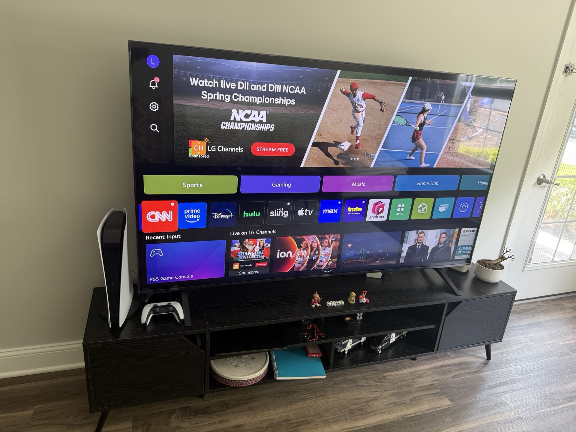 LG 75-inch Smart 4K TV and a black wooden TV stand