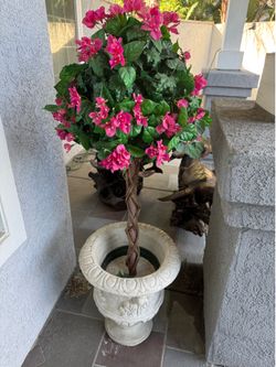 Concrete planter with faux flowers.