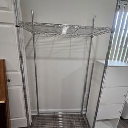 2 like new Metal 2 Adjustable shelve Garment Rack