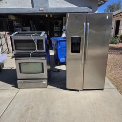 Stainless Steel Refrigerator, Electric Stove, Over Stove Microwave, & Dishwasher.