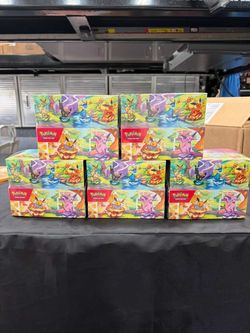 Pokemon Prismatic Mini tin display