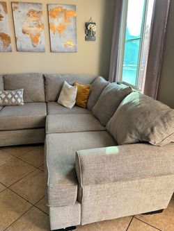 Large and beautiful beige sectional couch with deep seating from Jerome’s
