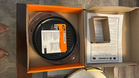 Brand new in box, Le Creuset grill pan with black interior, rare cassis color, retails $200, priced to sell