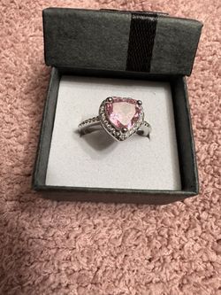 Stunning heart-shaped pink CZ ring with a brilliant halo setting. 
