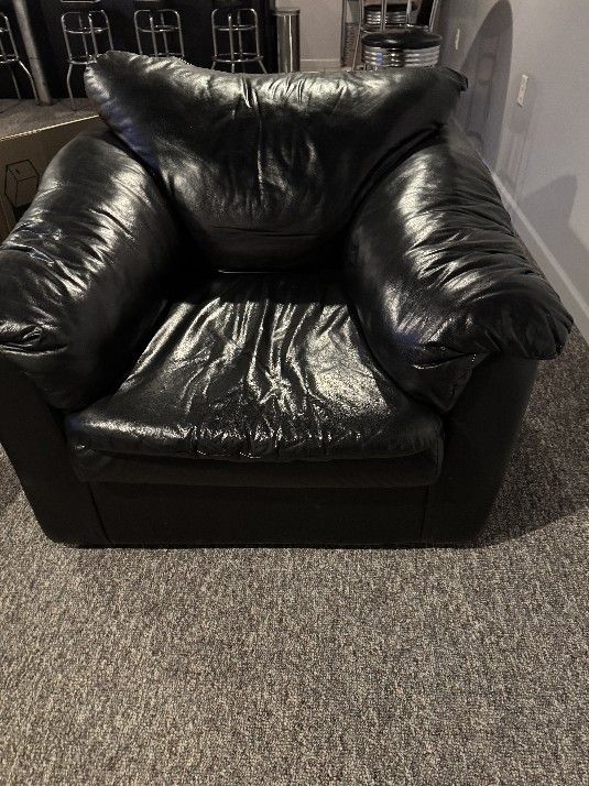 1 Black Faux Leather Couch. 2 Black Faux Leather Chairs.