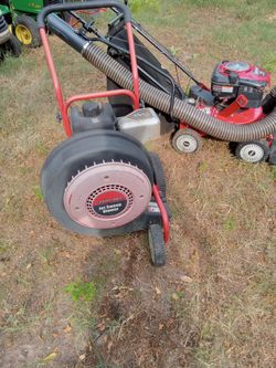 Troy bilt walk behind leaf blower and and Troy bilt 10 horsepower chipper And several riding mowers