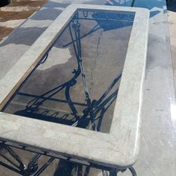 Glass and rod iron dinning table.