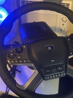 Hori steering wheel with shifter and pedals.