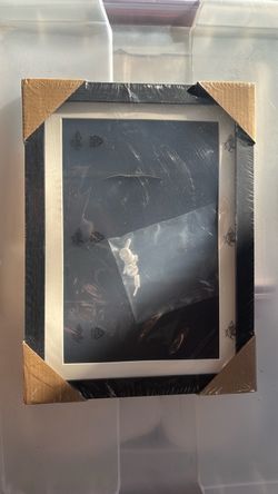 Black-and-white picture frame/shadow box.