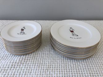Set of matching gold rimmed festive holiday plates