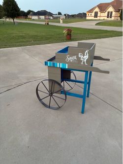 HANDCRAFTED TABLE WITH IRON WHEELS..Need Fresh paint..Issue in one leg