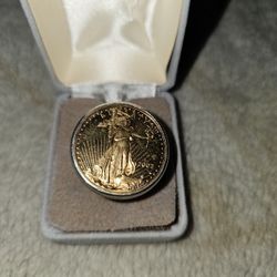 2003.    50.00. GOLD COIN   PUT. INTO A 14 KT. RING