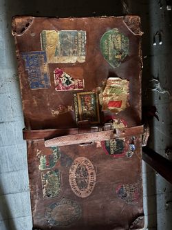 Vintage Leather Suitcase with Travel Stickers