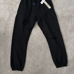 Black cuffed essentials pants