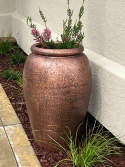 Taller clay urns 32”H new $125 each plant not included