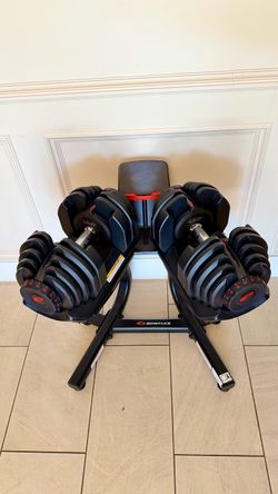 Pair of Authentic  Bowflex 1090 adjustable dumbbells with media stand