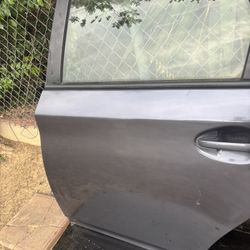 LEFT REAR DOOR FOR 2010-2015 TOYOTA PRIUS 3ER GENERATION DARK GRAY CHARCOAL COLOR.