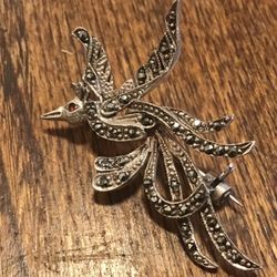 Sterling silver marcasite bird of paradise brooch with  ruby eye