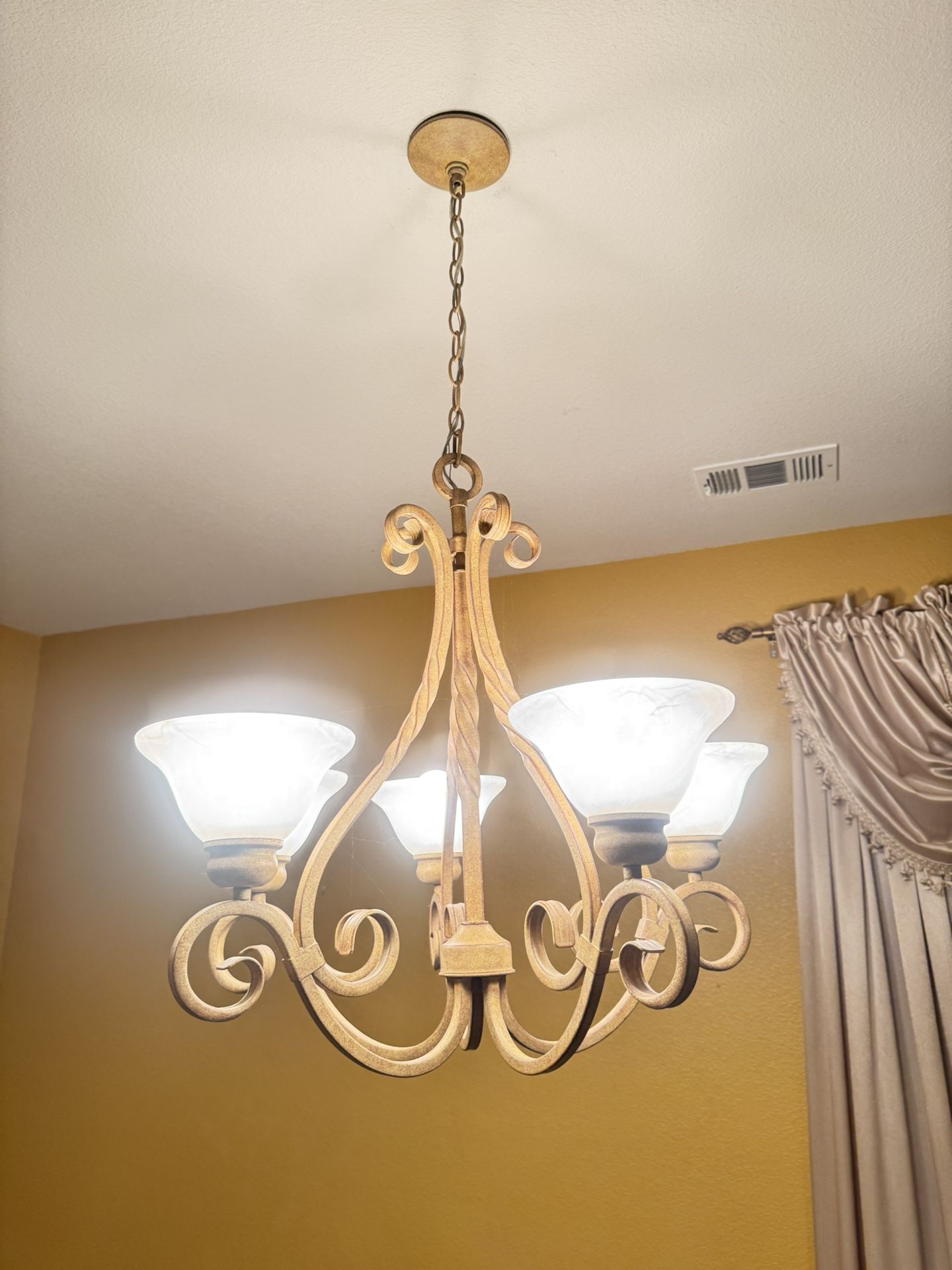 This is a Designers Fountain Mendocino 5-Light Forged Sienna Traditional Chandelier.