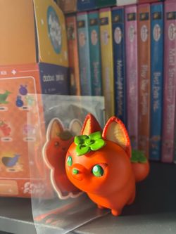 Orange Fox Collectible Figure with Green Flower