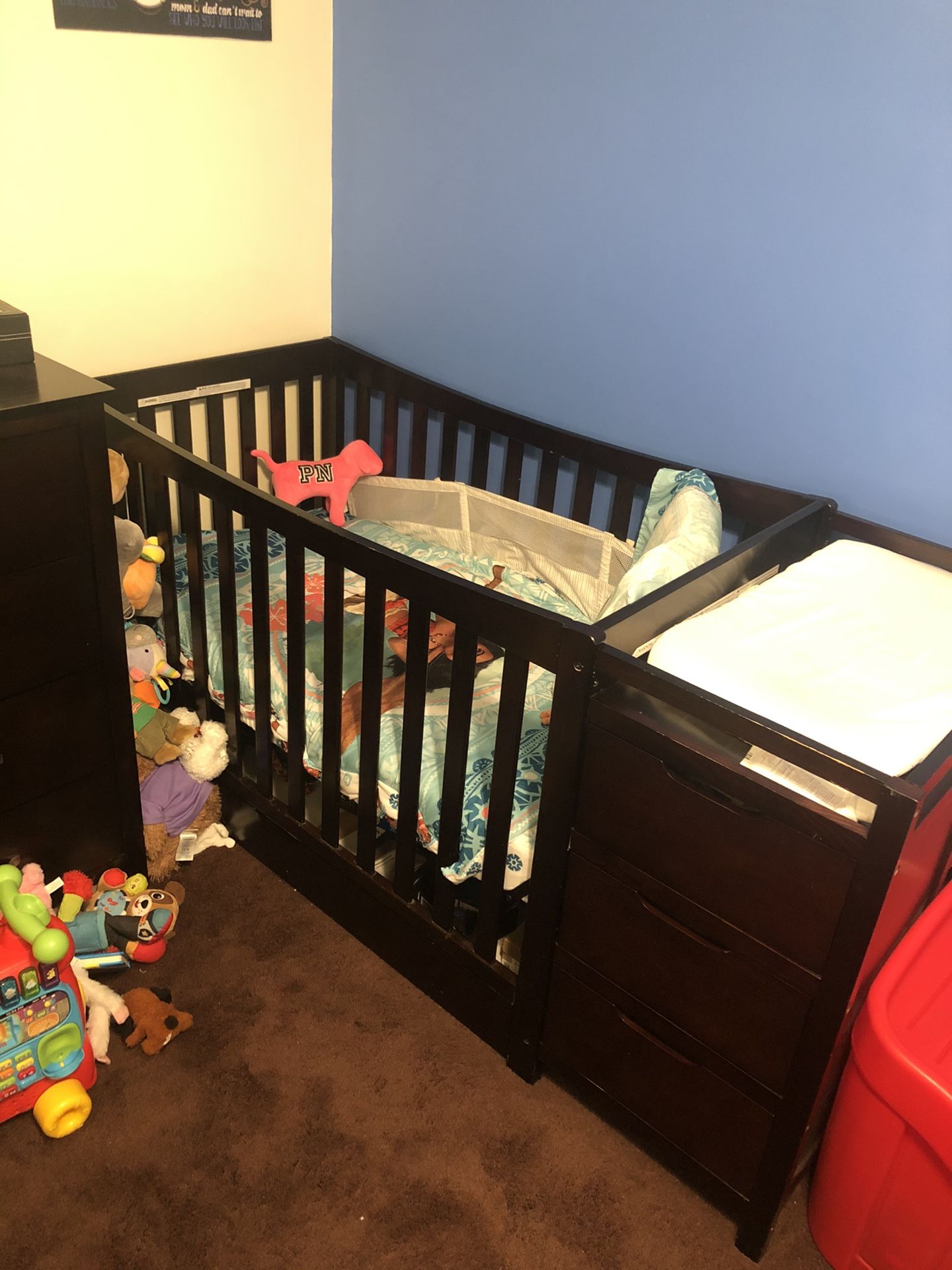 Convertible crib with changing table.