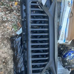 Two Different Jeep Grills 