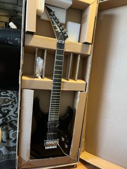 Guitar is New old stock Jackson Pro SL7, Gloss Black