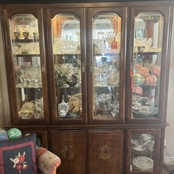 Asian Inspired China Cabinet With Display Lights On Inside 