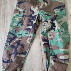 Bags Of Military Issued Woodland Camo Pants And Tops