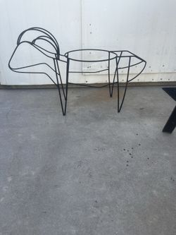 A wire frame shaped like a goat