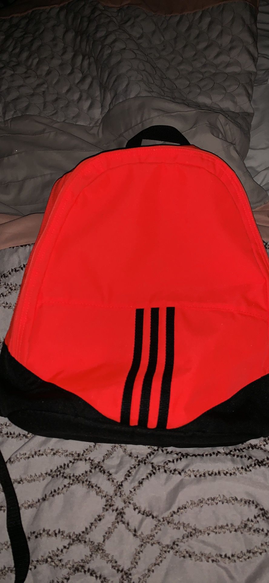 Adidas orange and black backpack