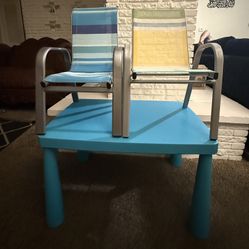 Colorful kids' table with two matching chairs.