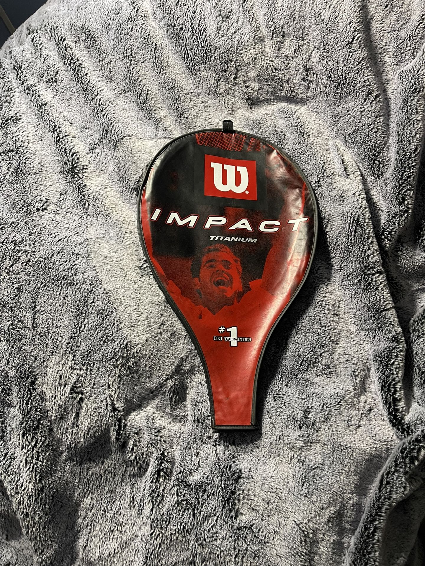 MG Carbon 3001 tennis racket with a Wilson impact cover