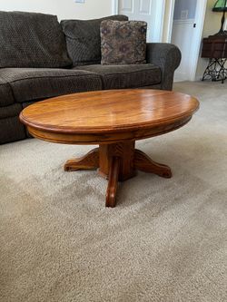 Solid wood coffee table, oval shape