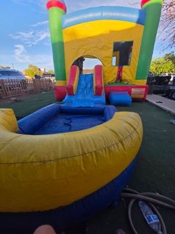 Bounce house with slide and pool