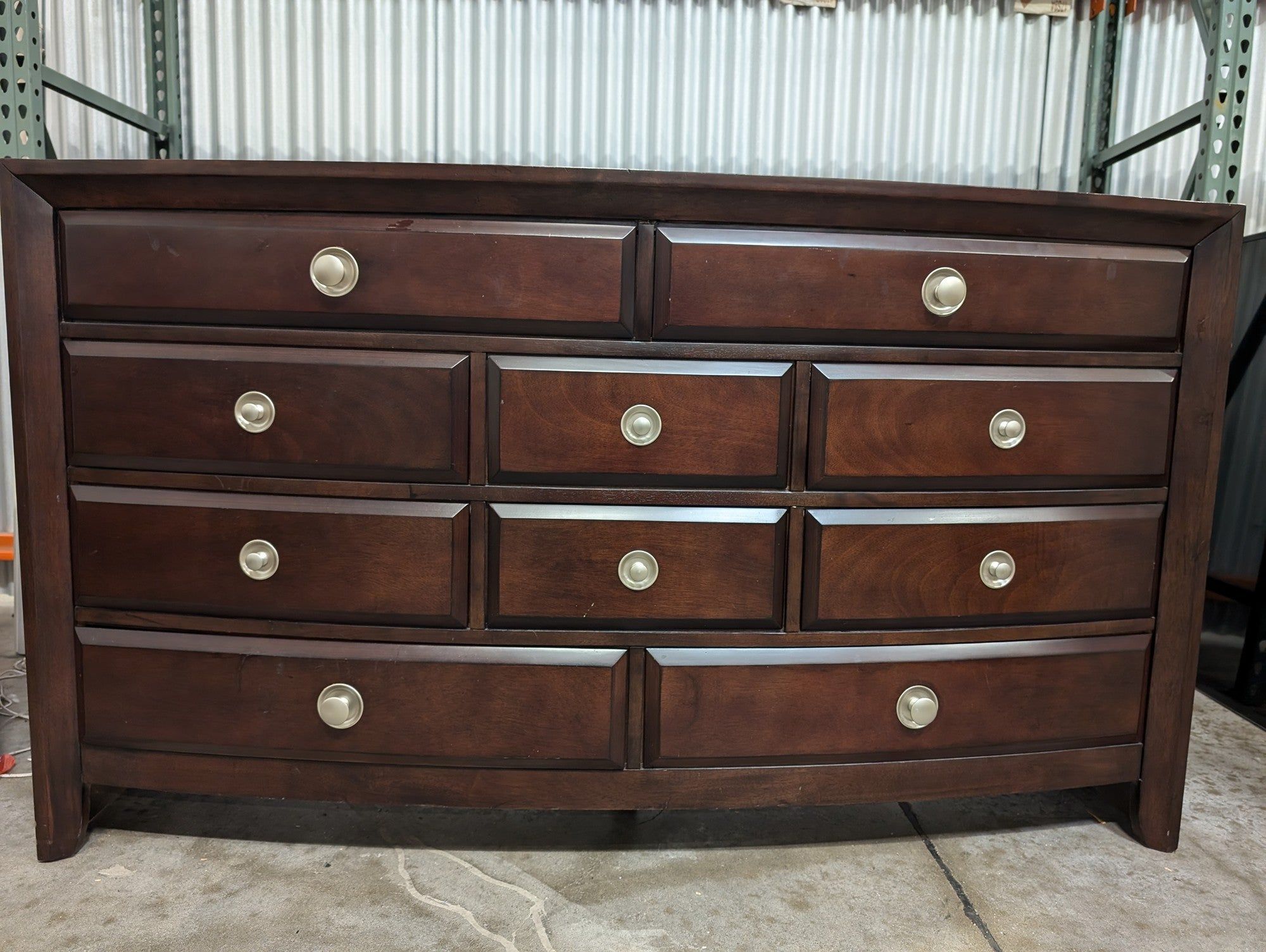 Dark Wood Curved Front Nine-Drawer Dresser