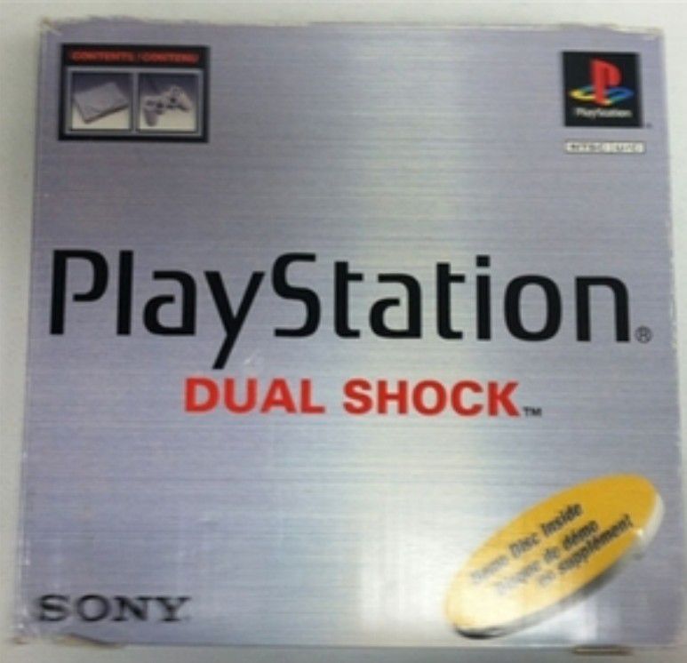 Playstation 1 system in box with games.