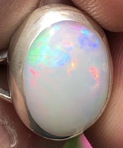 4590 Large Ethiopian Welo Opal Flag/Chaff pattern flash. Solitaire solid 925 sterling silver ring Gem is 8.2ct 16x12x6.5mm size 7 1/2 USA
