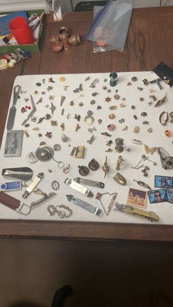 Assorted pinbacks, war lapel pins, collectible beer bottle openers, miniature brass clocks for dollhouse etc.
