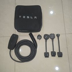 Tesla charger connectors 240 v and 120 v.