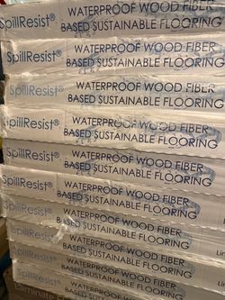 Waterproof fiber based flooring